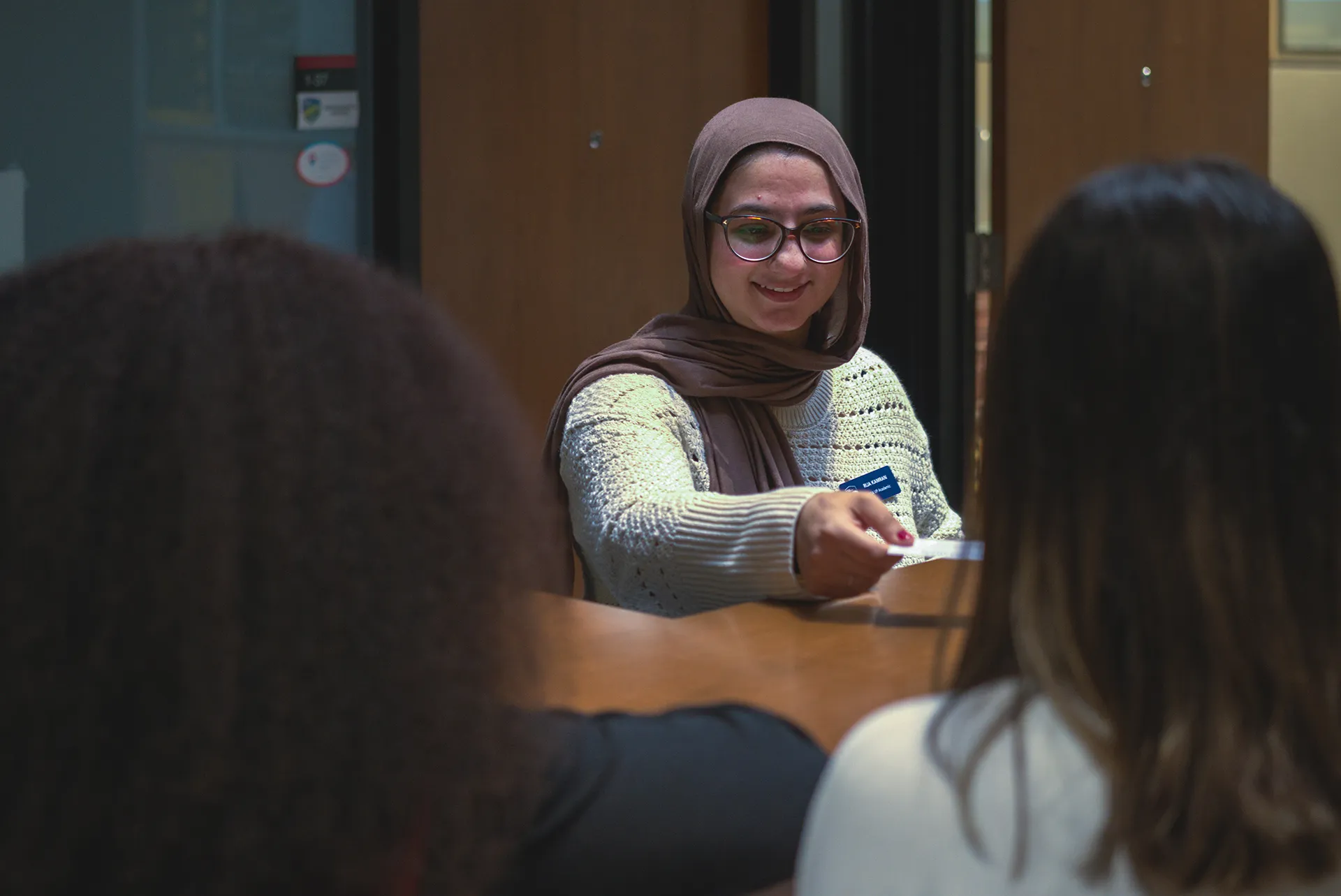 Graduate Students' Association GSA student handing out card